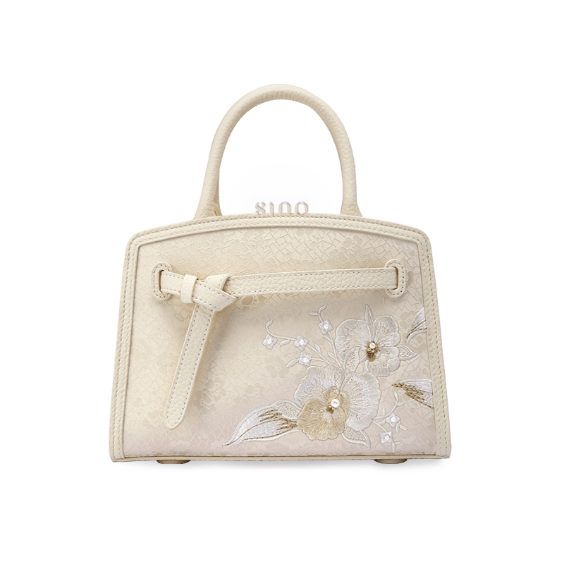 Front view of the Luxury Shuanglin Silk Orchid Butterfly Embroidered Leather Top Handle Bag in an elegant ivory tone with delicate embroidered floral details.