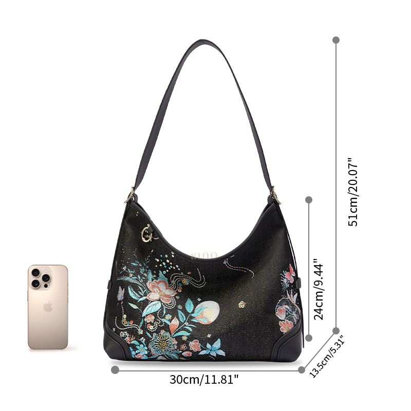Size reference image of the Luxury Song Brocade Blooming Flowers Leather Crossbody Bag, shown with a phone for scale.