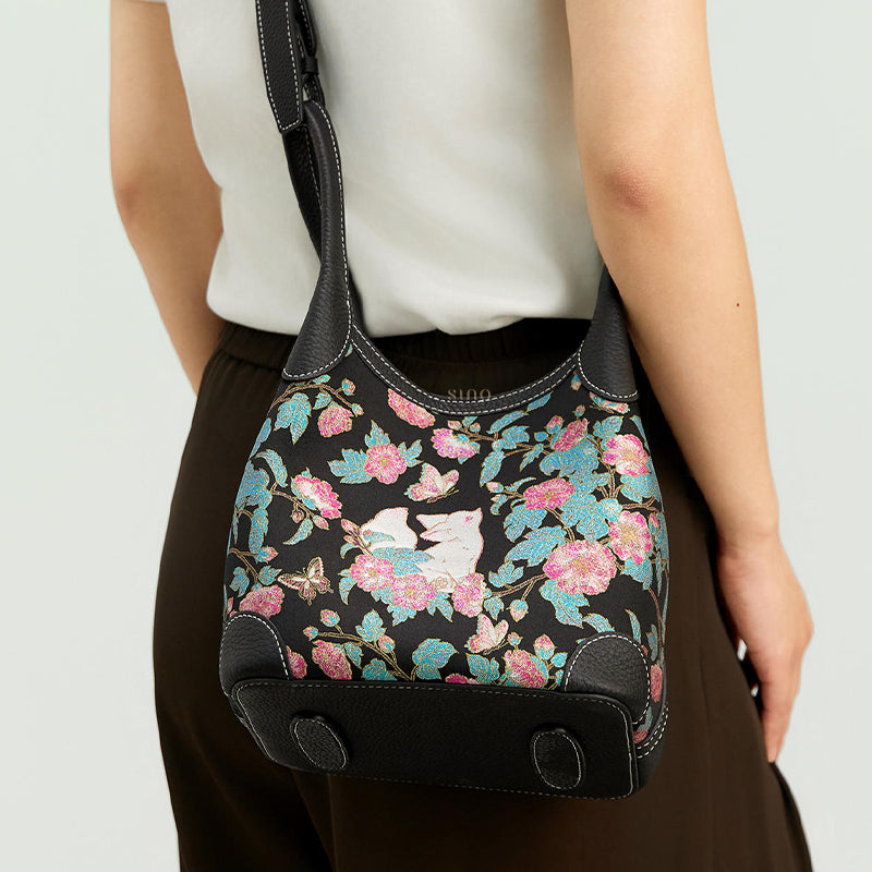 Back model view of the Luxury Song Brocade Butterfly and Auspicious Fox Basket Tote Bag, showing the shoulder carry style, structured base, and black leather trim.