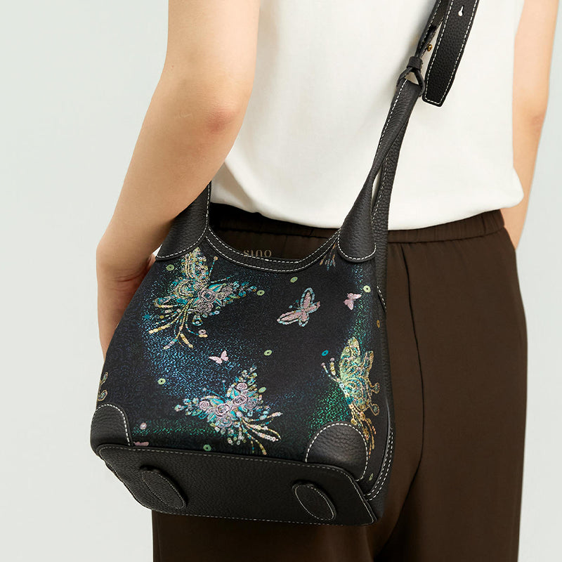 Back model view of the Luxury Song Brocade Butterfly & Pearl Leather Basket Tote Bag, showing the shoulder carry style, structured base, and black leather trim.