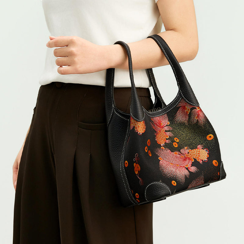 Side model view of the Chinoiserie Song Brocade Golden Carp Leather Basket Tote Bag, highlighting the red and gold carp brocade pattern and elegant daily styling.