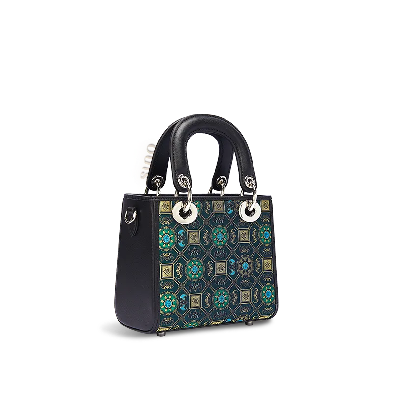 Side view of the luxury Song Brocade Lotus and Auspicious motif mini crossbody bag.