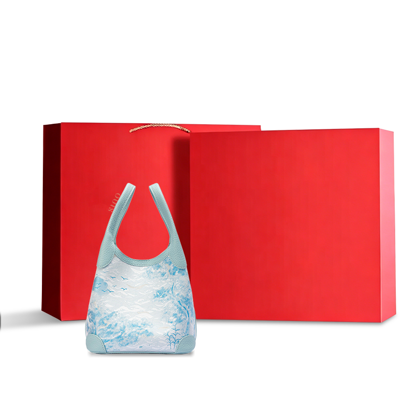 Luxury Song Brocade Misty Mountain Forest Leather Basket Tote Bag displayed with a red gift box, ideal for elegant gifting and premium retail presentation.