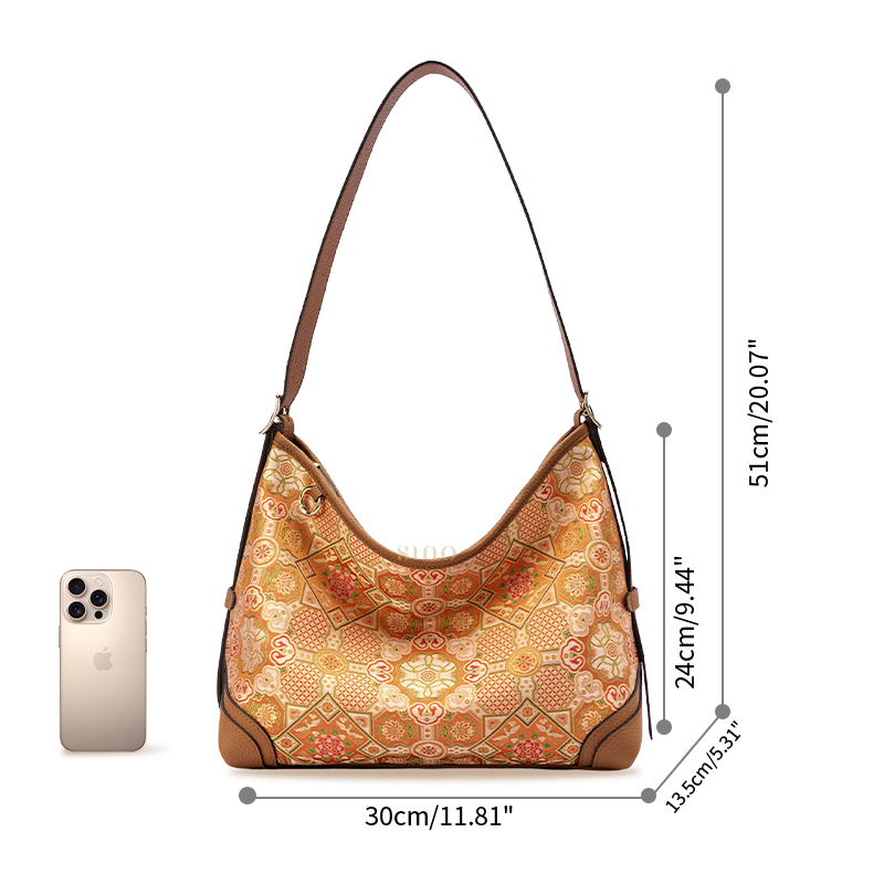 Size reference image of the Luxury Song Brocade Orange Peony Motif Leather Crossbody Bag, shown with a phone for scale.