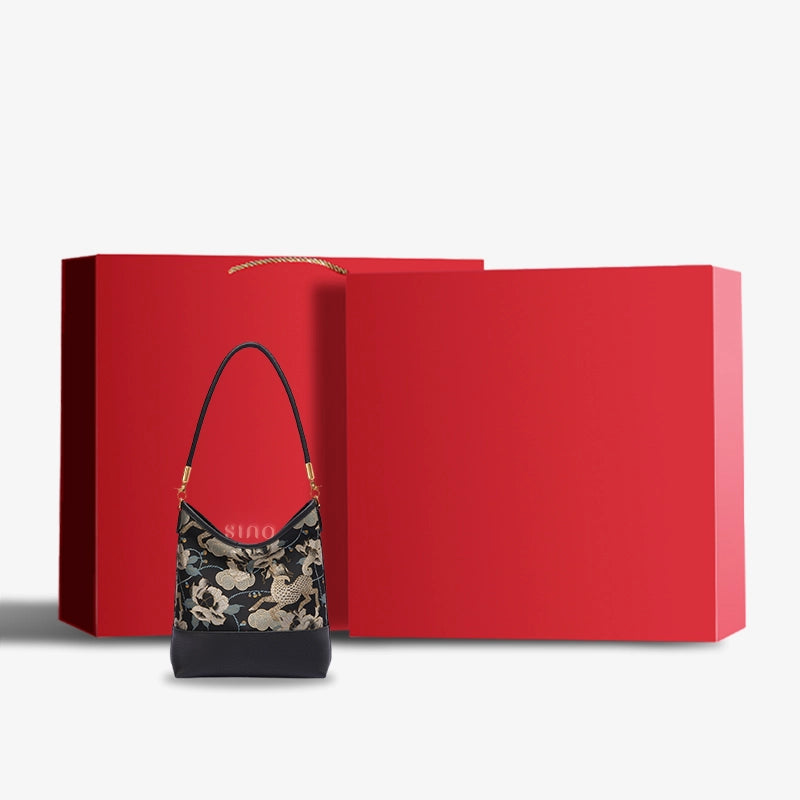 Luxury Black Gold Qilin Peony Song Brocade shoulder bag presented with an elegant red gift box.