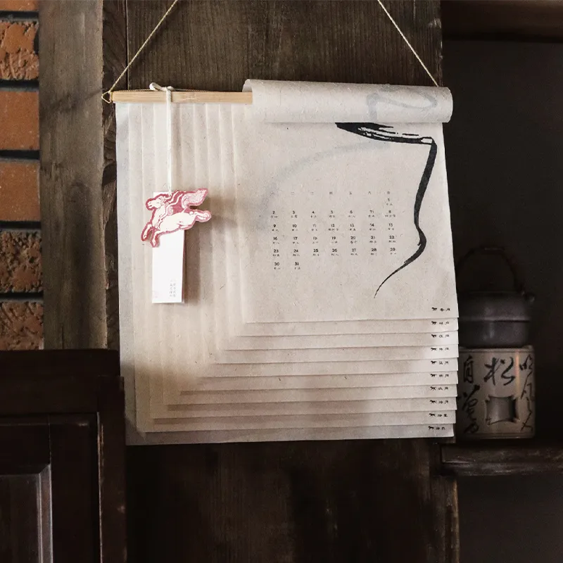 2026 Year of the Horse Mulberry Bark Paper Art Calendar – Elegantly hung on a wall, showcasing traditional Chinese design.