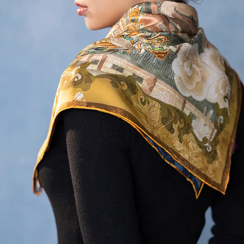 Luxury Nanjing Brocade Bloom mulberry silk square scarf draped over the shoulder, featuring palace flowers and gold border details.