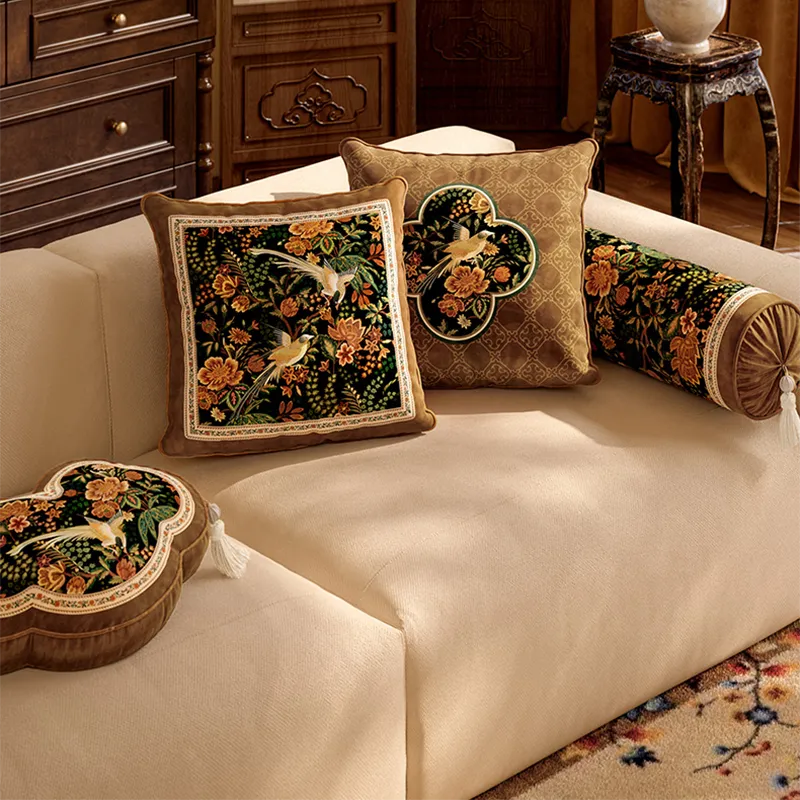 Overhead view of luxury chinoiserie magpie pillows on sofa.