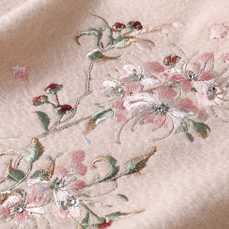 Artisan plum blossom embroidery texture, showcasing fine threadwork.