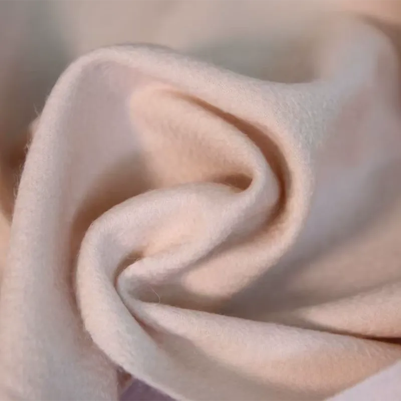 Silky-soft cashmere scarf draping elegantly, demonstrating flexibility.