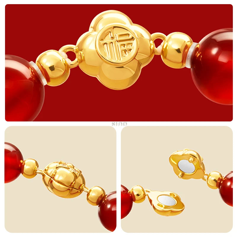 Close-up of the gold-tone bracelet clasp with an auspicious Chinese character, polished red agate beads and delicate gold-tone accents on this lucky bracelet.