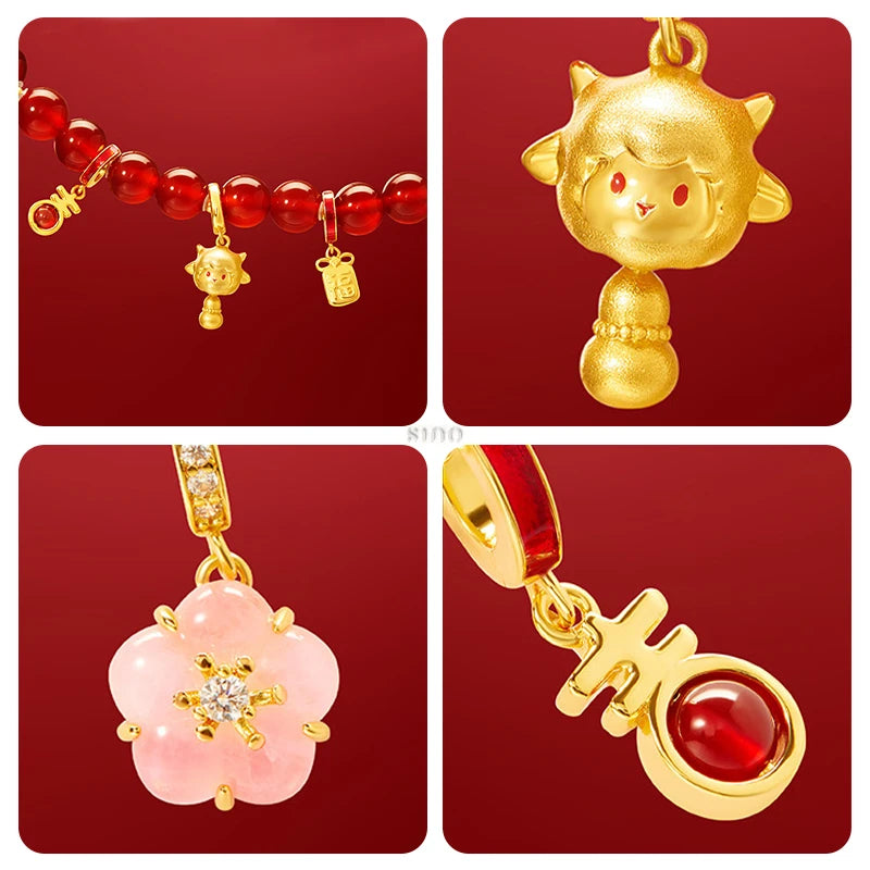 Close-up of a red agate beaded bracelet with gold-tone lucky charms, including a goat-inspired pendant, floral charm and auspicious Chinese New Year symbols.