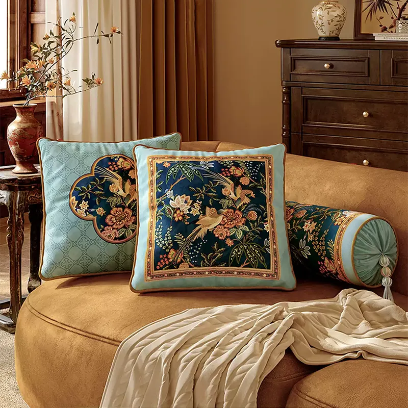 Luxury chinoiserie watercolor pillows with armrest pillow on sofa.