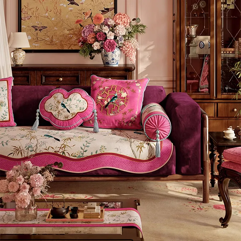 Ruyi and armrest chinoiserie window lattice pillows on sofa left side.