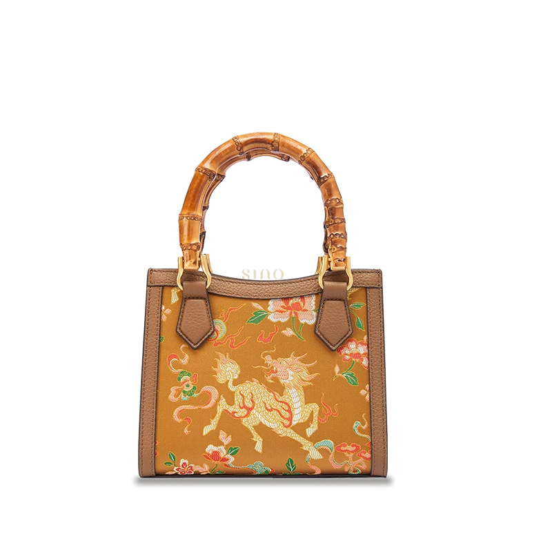 Shu Brocade Auspicious Qilin motif bamboo handle handbag crafted with silk brocade and leather details.