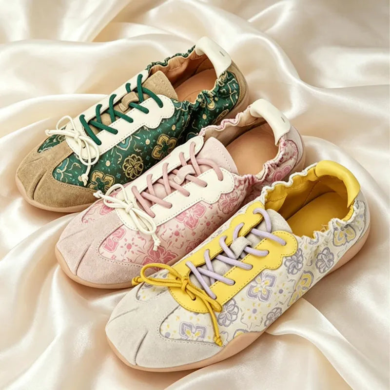 Detail view of Shu Brocade ballet sneakers with intricate Persimmon Motif patterns and traditional textile artistry.