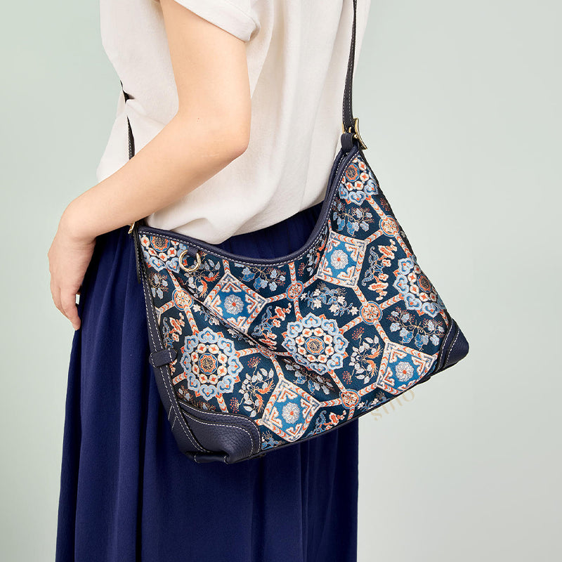 Close-up detail of the Baoxiang floral pattern on Luxury Song Brocade Blue Crossbody Bag, showing embroidery texture and silk sheen.