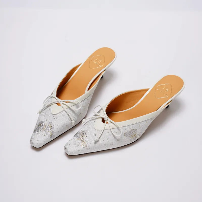 Pair of Song Brocade Butterfly Reverie kitten heel mules showcasing traditional Chinese textile patterns and modern mule design.