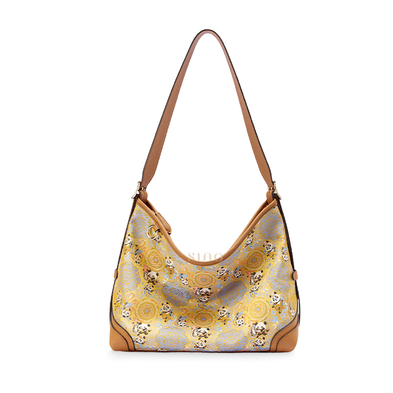 Front view of the Luxury Song Brocade Chang’an Court Dance Leather Crossbody Bag, featuring panda motifs, court dance elements, and brown leather trim.