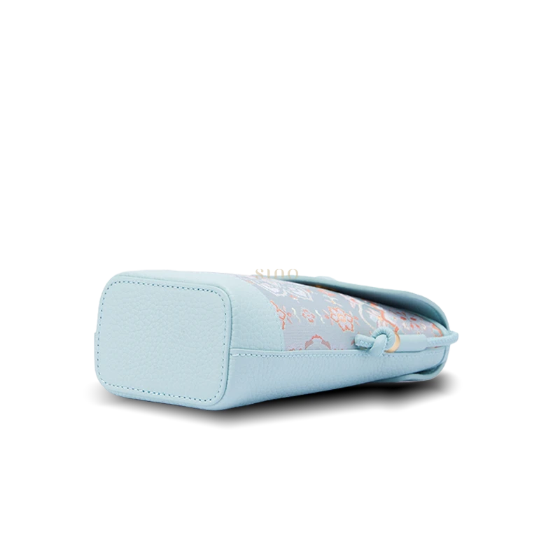 Song Brocade crossbody phone bag bottom view showing the structured leather base and compact phone purse shape.