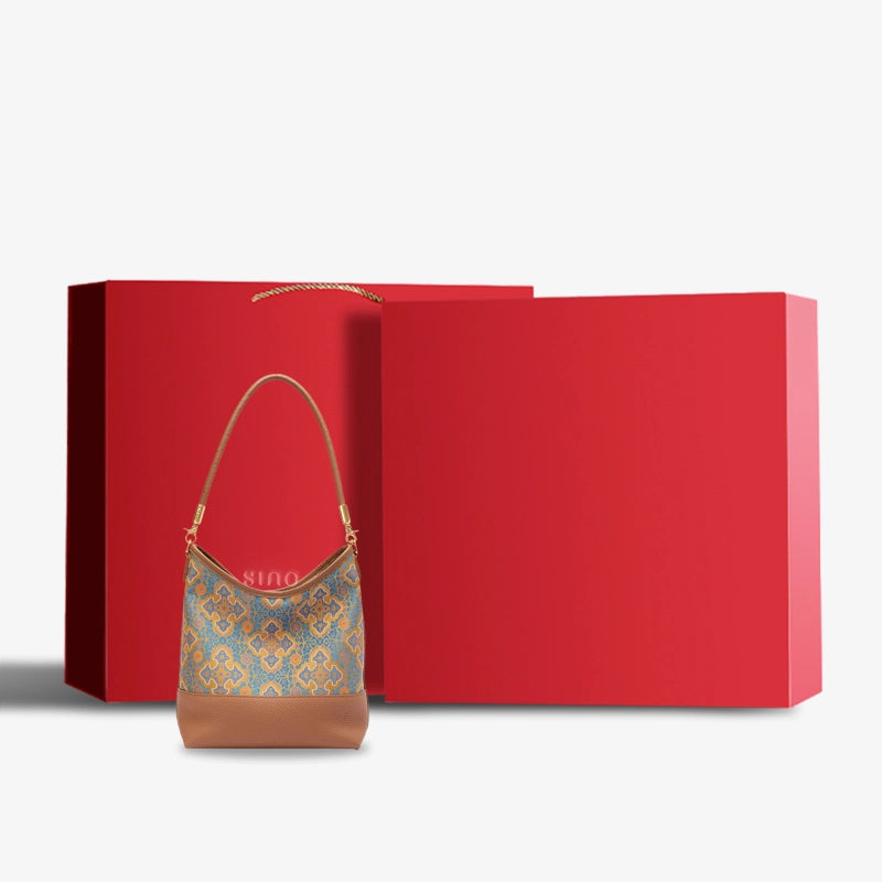 Chinoiserie Luxury Song Brocade Ruyi Motif Leather Shoulder Bag displayed with elegant red gift box packaging.