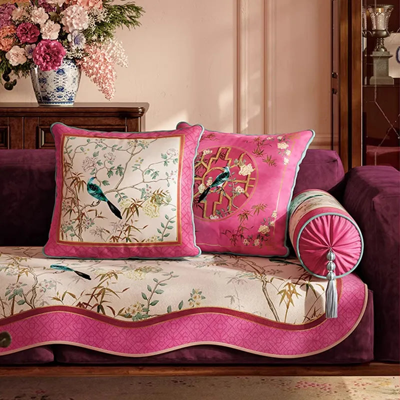 Square and pink chinoiserie window lattice pillows on sofa.
