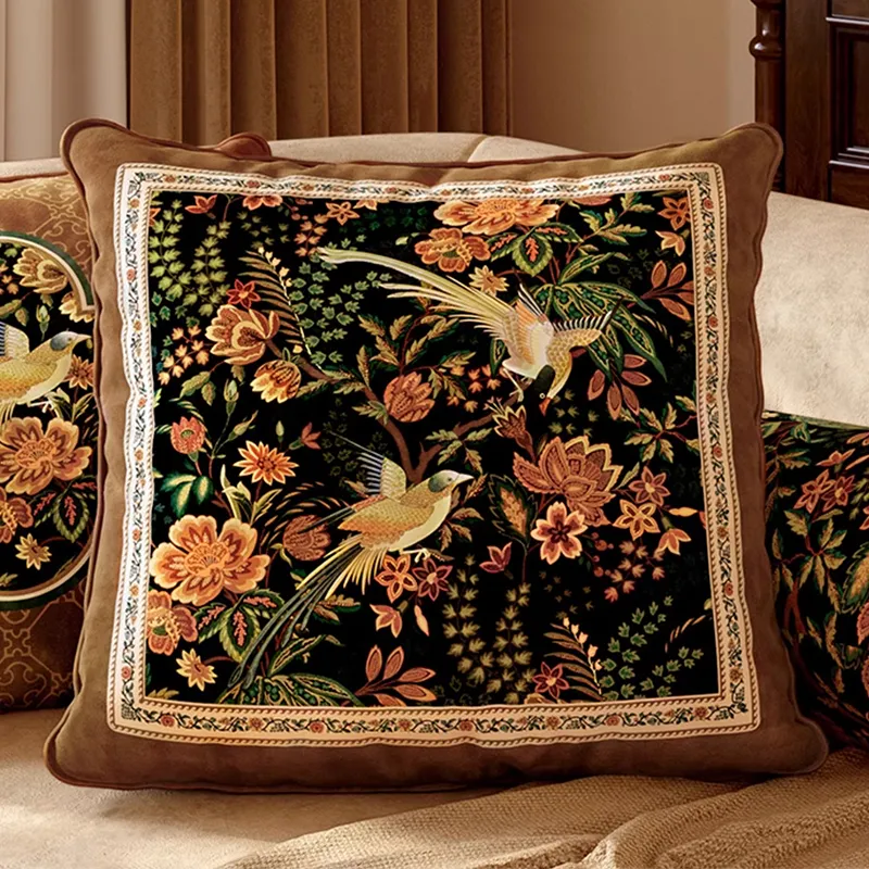 Close-up of luxury chinoiserie magpie blossoms pillow on sofa.