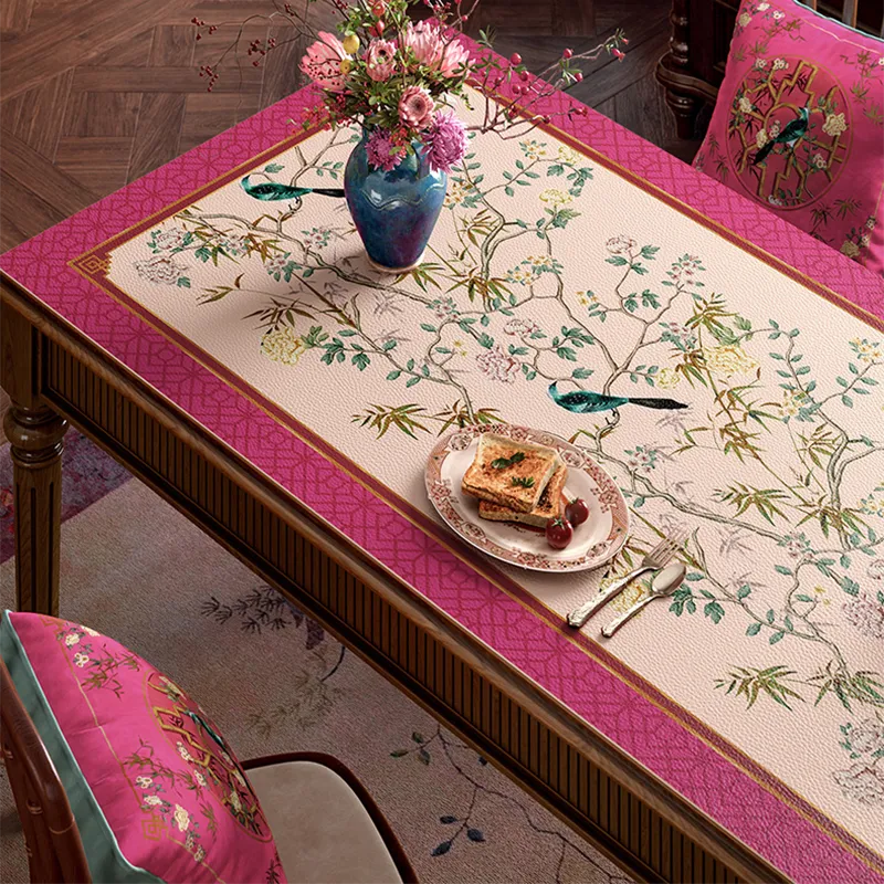 Left detail of pink chinoiserie table mat with vase.