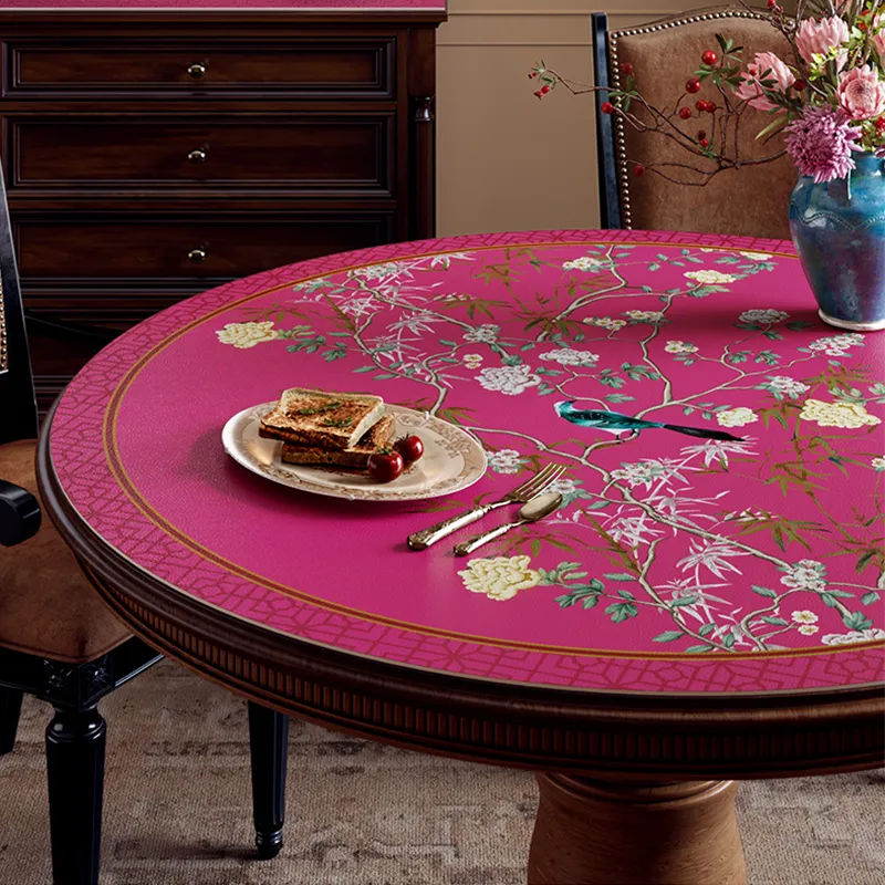 Chinoiserie floral bird table mat with vase and pastries, left detail.