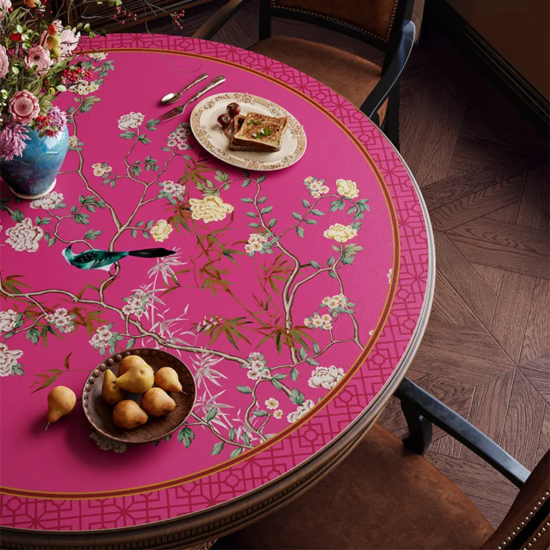 Pink retro floral bird table mat detail with pastries, top view.