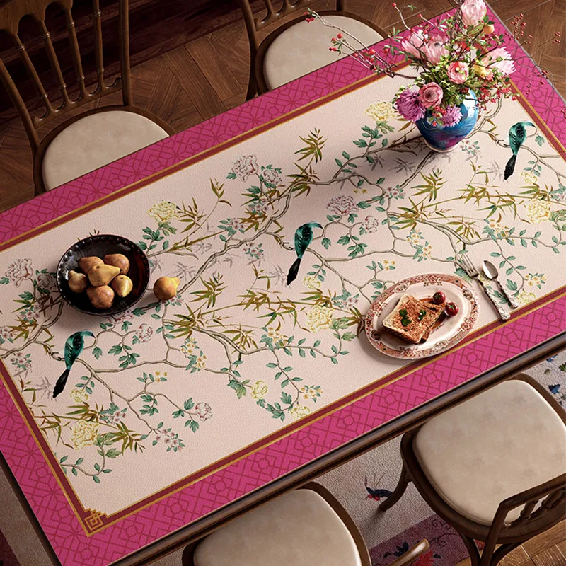 Top view of pink floral bird table mat with dining set.
