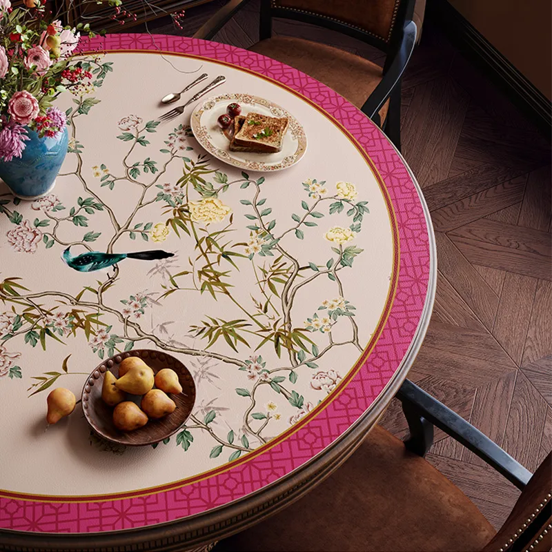 Light center floral bird table mat with pastries, top view.
