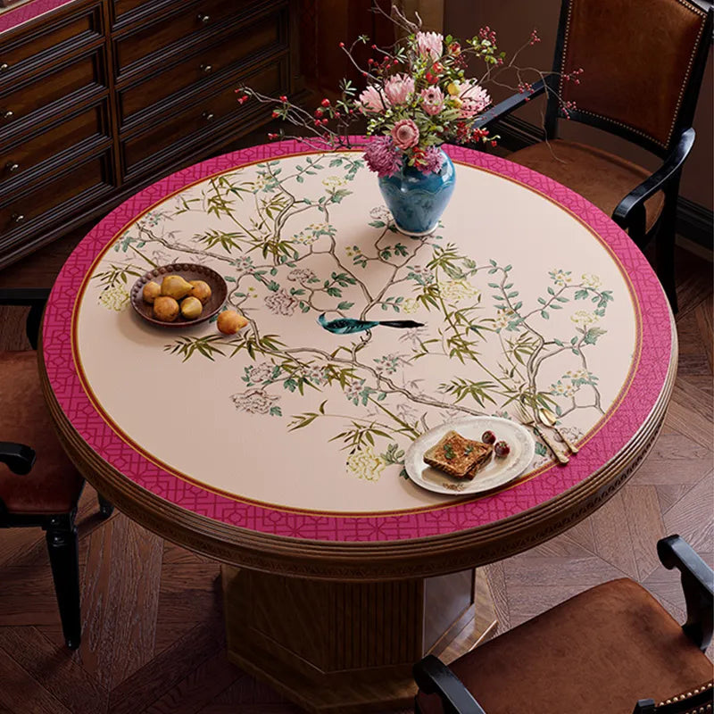 Pink chinoiserie table mat with light center, top view.