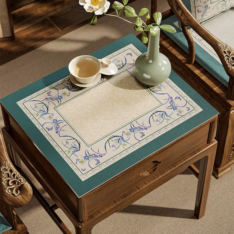 Summer blue leather bedside table mat with floral border.