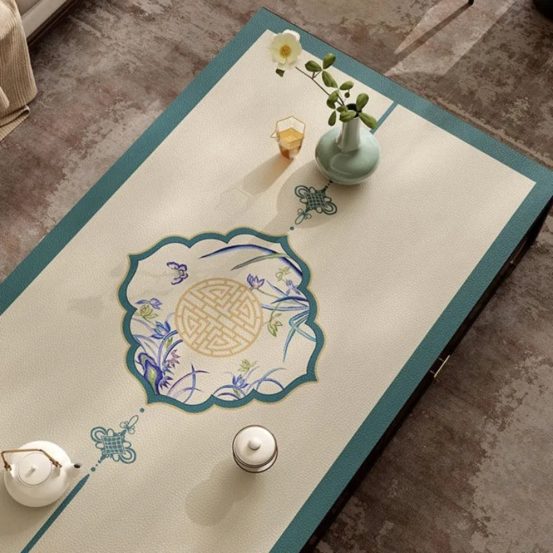 Summer blue leather coffee table mat with central Chinoiserie pattern.