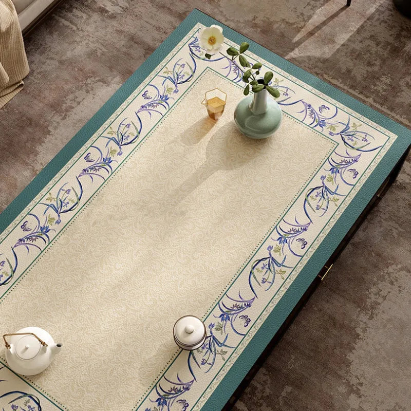 Summer blue leather coffee table mat with floral border top view.