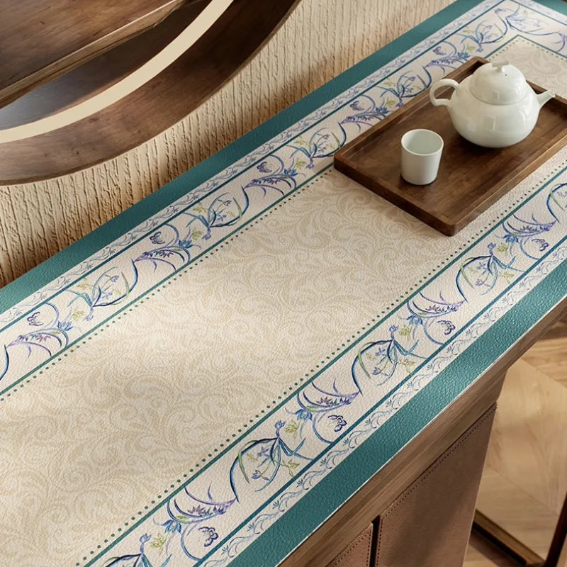 Summer blue leather sideboard table mat with floral detail.
