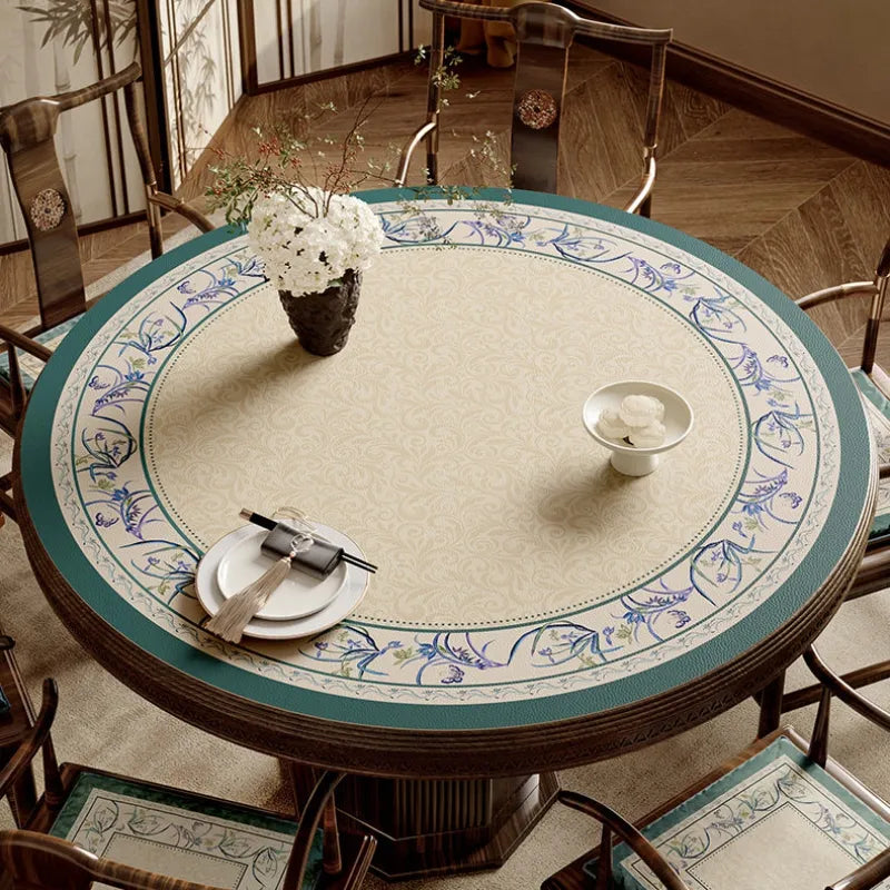 Summer blue round leather table mat with Chinoiserie floral border.