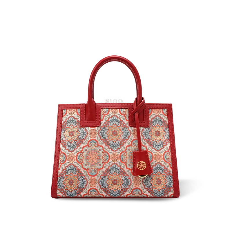 Red Song brocade handbag with gilded Baoxiang motif and leather handles.
