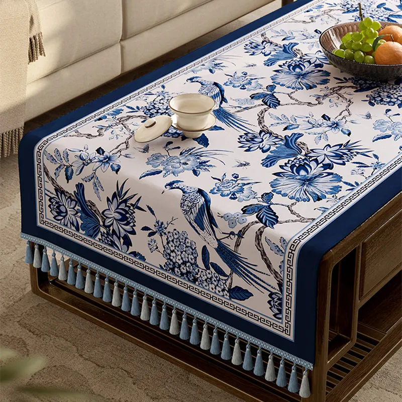 Decorative fringe trim on porcelain-style tablecloth.