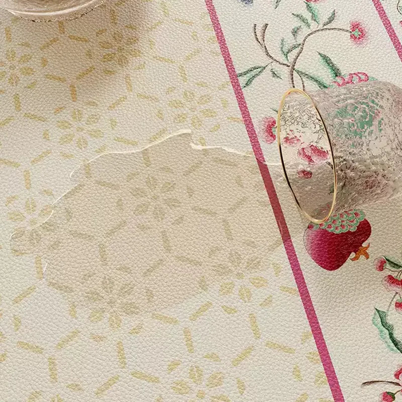 Waterproof coral pink leather dining table mat with easy-clean surface.
