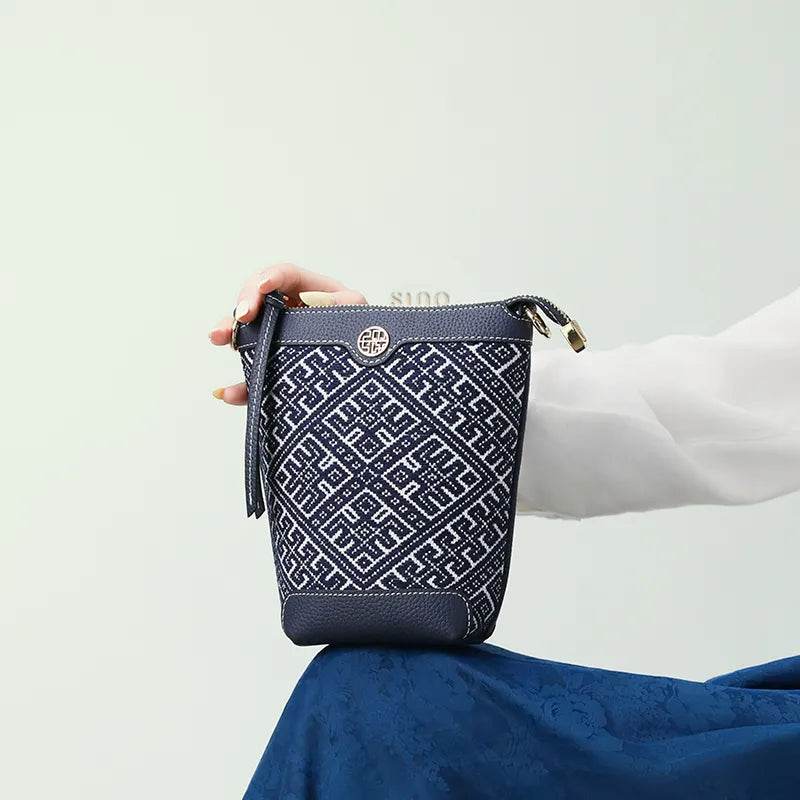Zhuang Brocade Flying Swallow Motif Embroidered Leather Bucket Crossbody Bag - SinoCultural -- FJ210617