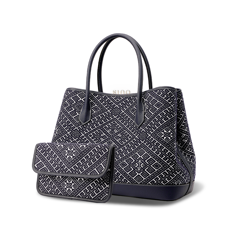 Side profile of Zhuang Brocade Embroidered Leather Shoulder Bag, highlighting its structured silhouette.
