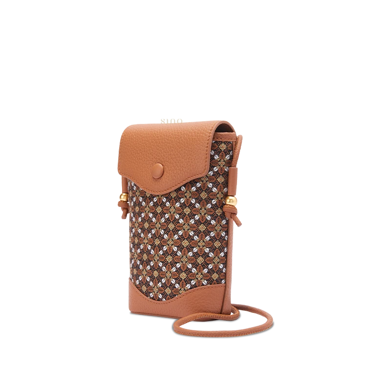 Angled front view of a brown Zhuang brocade Osmanthus crossbody phone bag with a patterned fabric panel, leather flap and gold-tone accents.