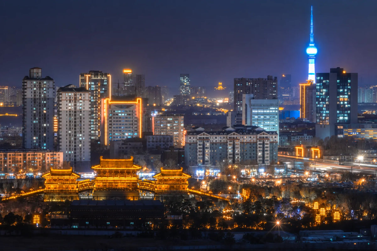Night view of Luoyang ancient city and modern skyline in China, featured in the Luoyang Travel Guide.