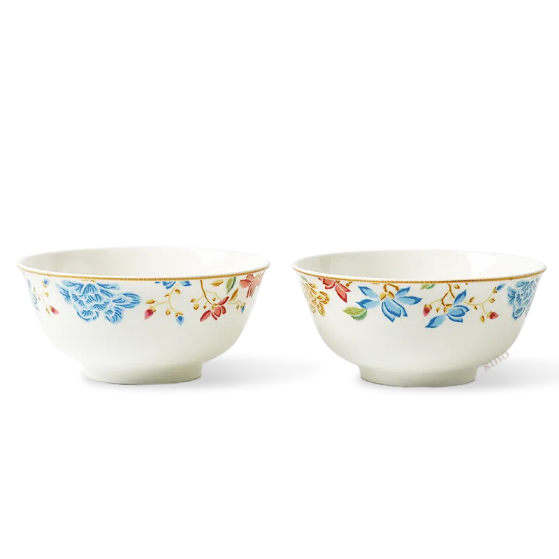 Two Chinoiserie bone china round bowls in symmetric front view with floral design.