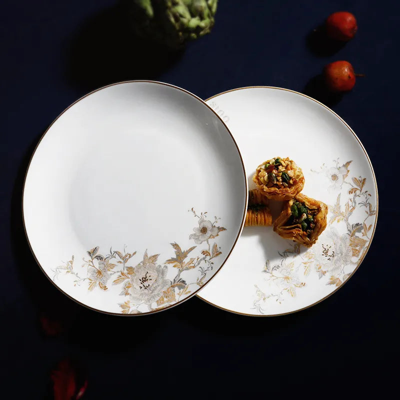 Overhead view of stacked Chinoiserie Bone China Platters with desserts on one plate.