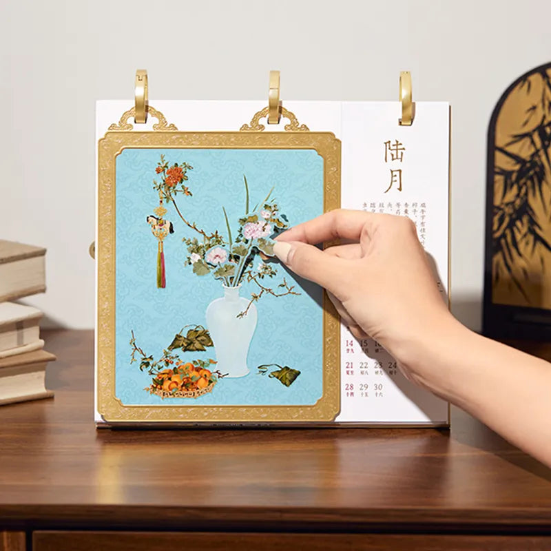 Multi-layer desk calendar on a desk with stationery, showcasing practical use.