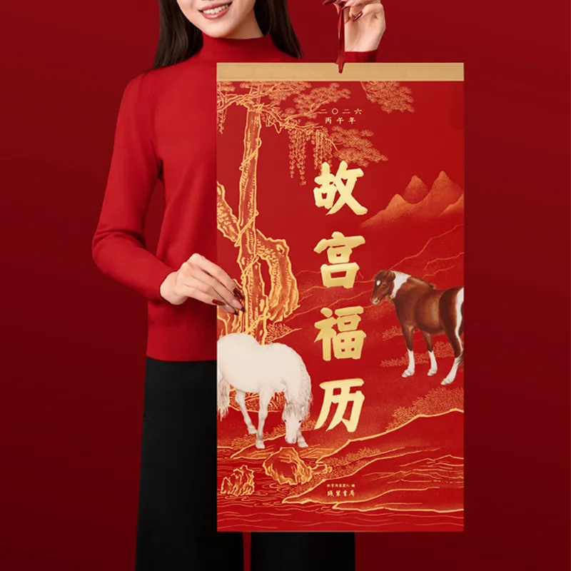 Person holding 2026 Fire Horse Year tear-off calendar, demonstrating practical size.