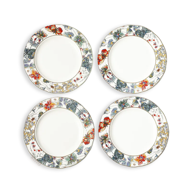 Four Chinoiserie bone china scalloped dinner plates with butterfly and floral design, arranged in two rows.